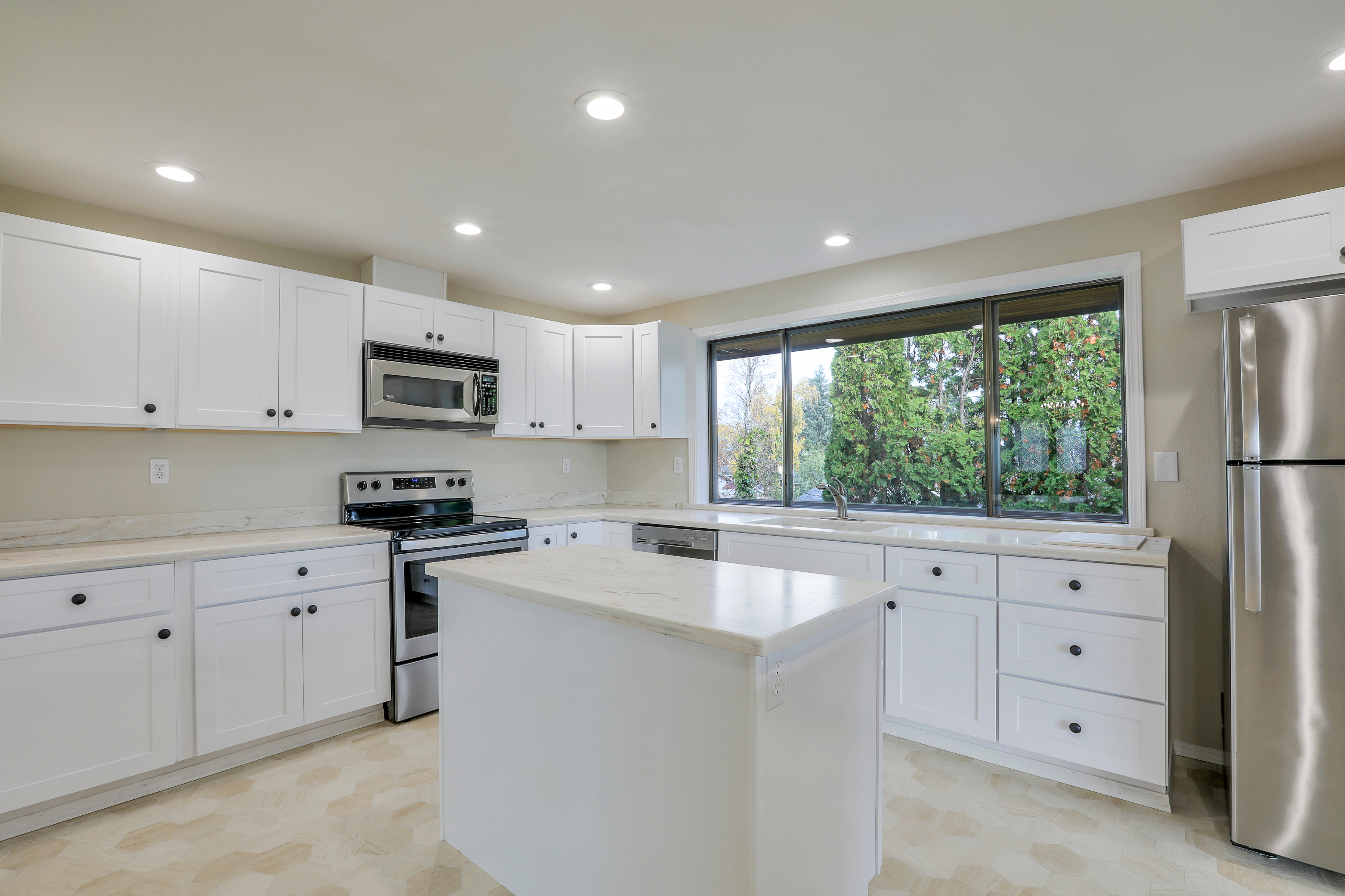 Recently updated kitchen featuring <br>Corian counters and stainless appliances