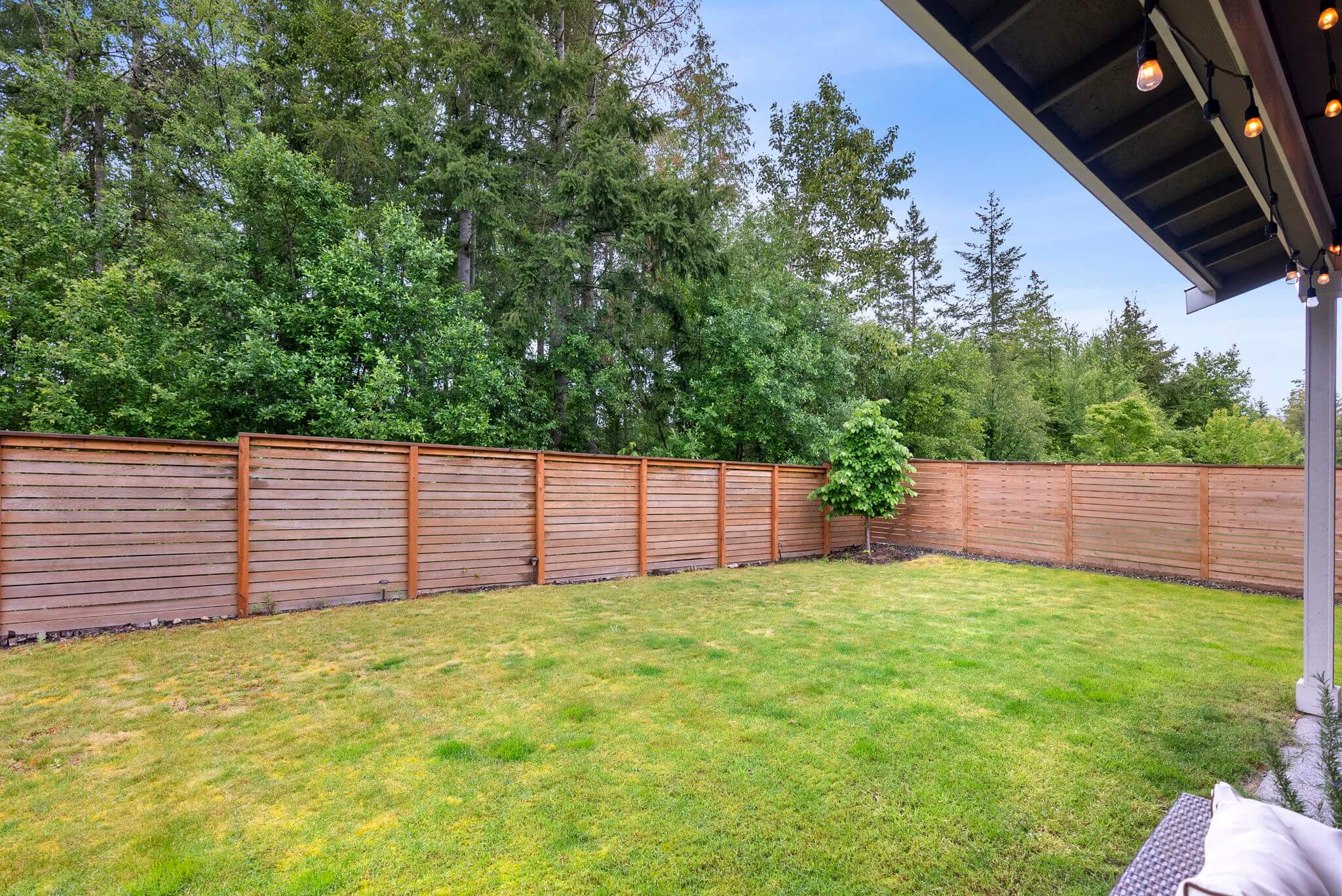 Fully fenced yard backs up to greenbelt for added privacy