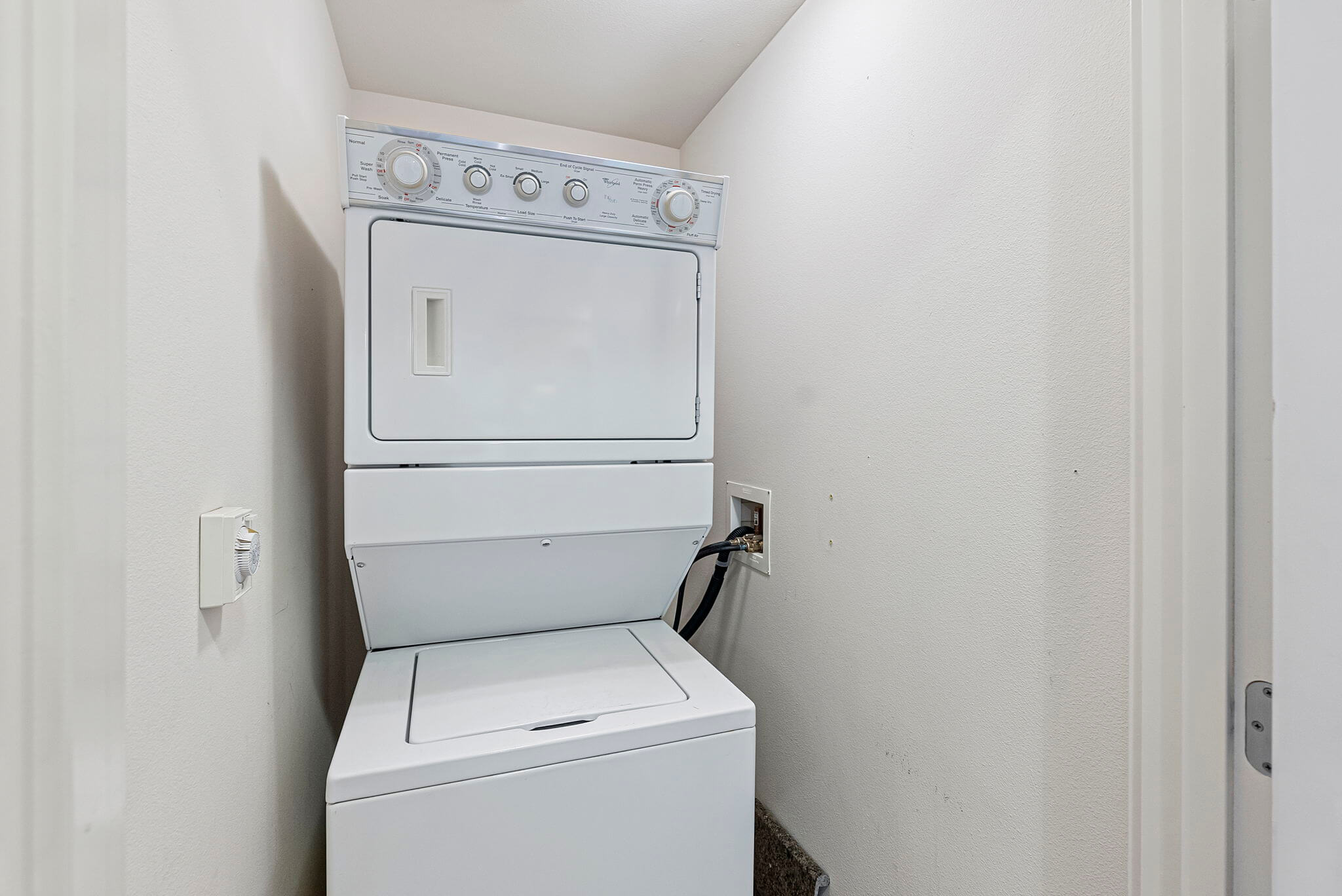 Utility closet with stacked washer/dryer