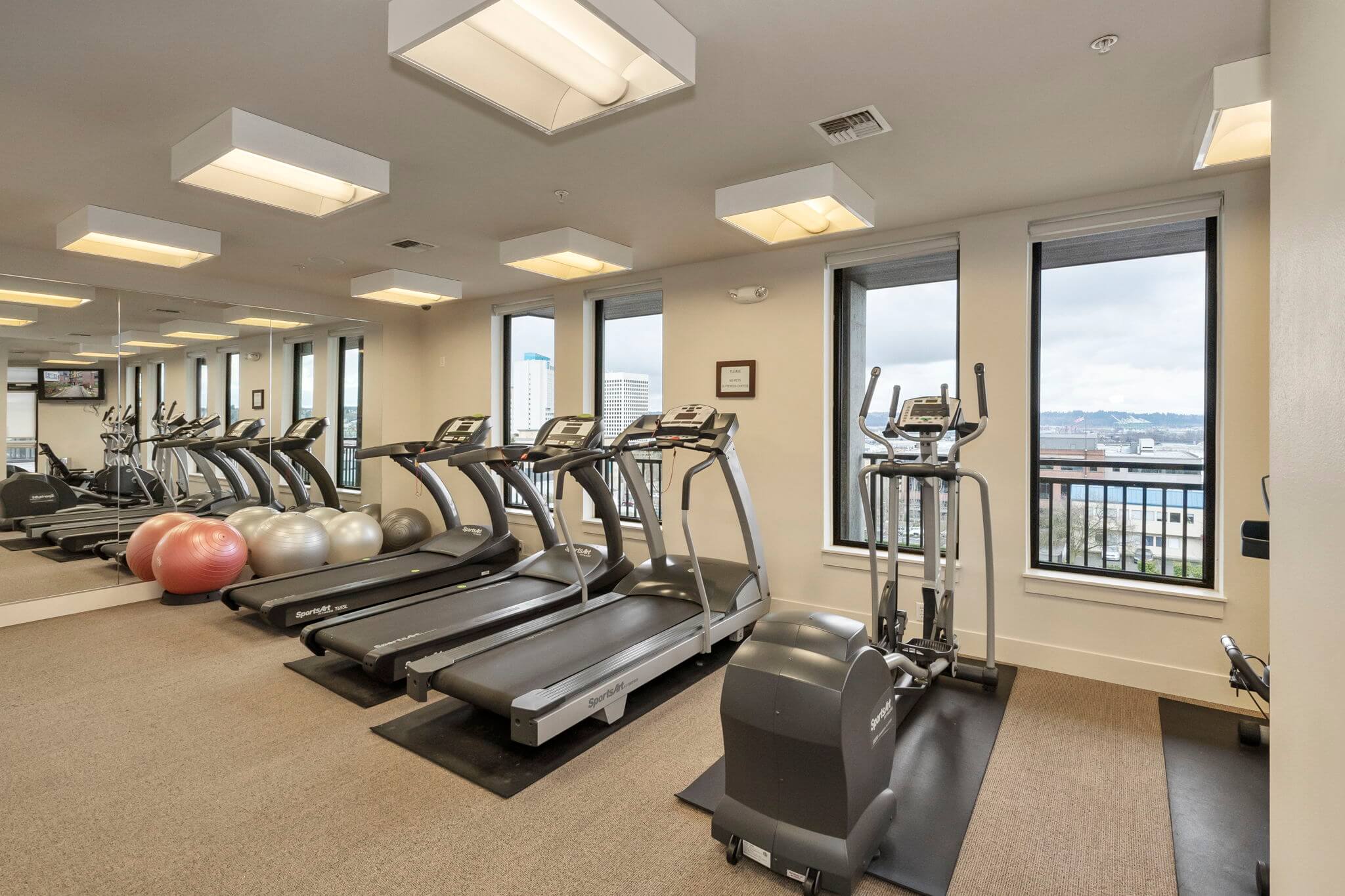 Fitness room with cardio equipment is located on the ground floor