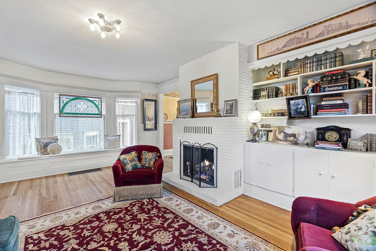 Gas fireplace and large bay window with seat