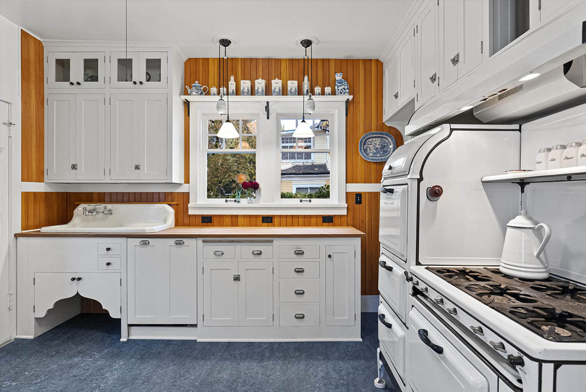 Thoughtfully updated kitchen with custom cabinetry and Marmoleum floors