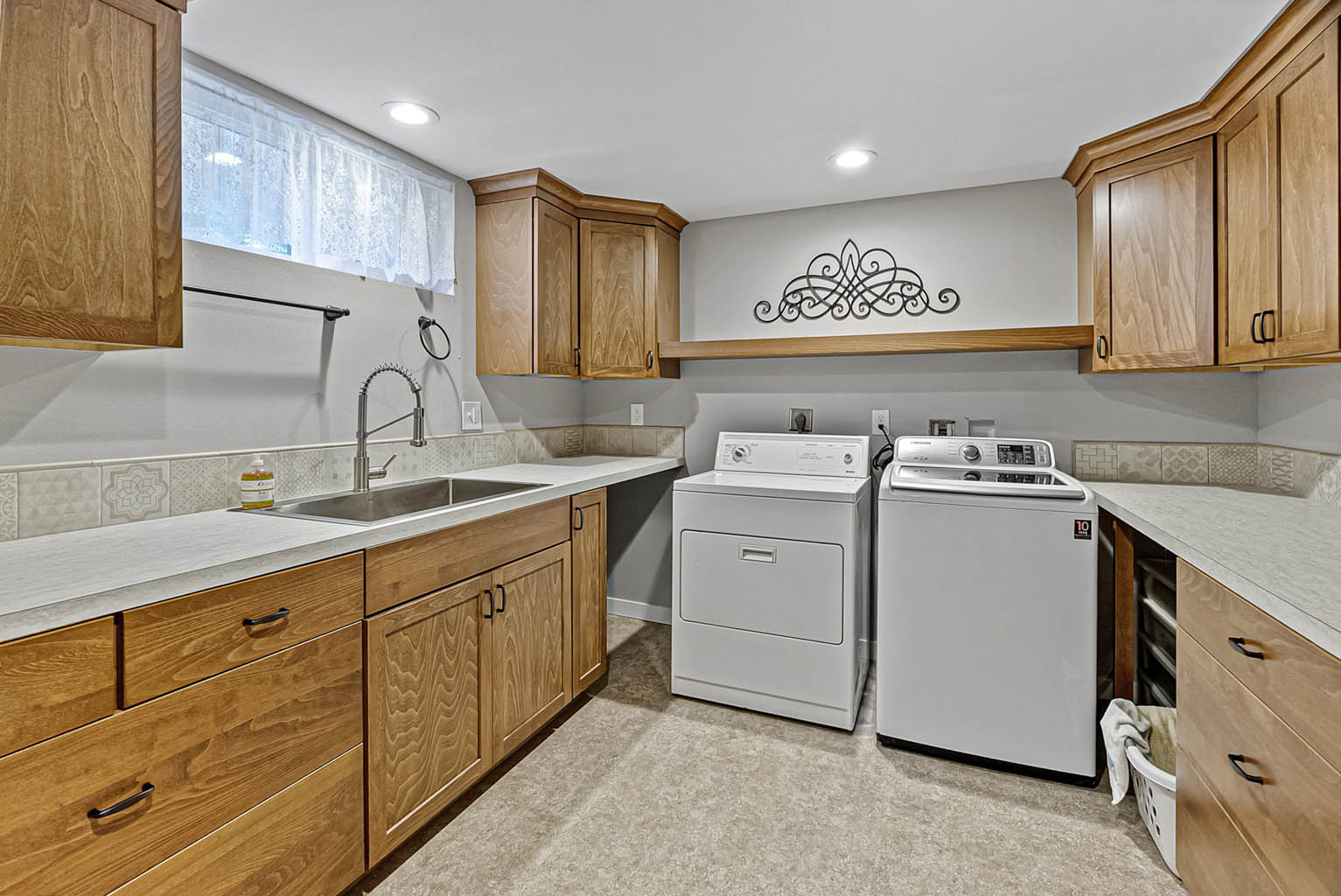 Spacious laundry room with ample storage
