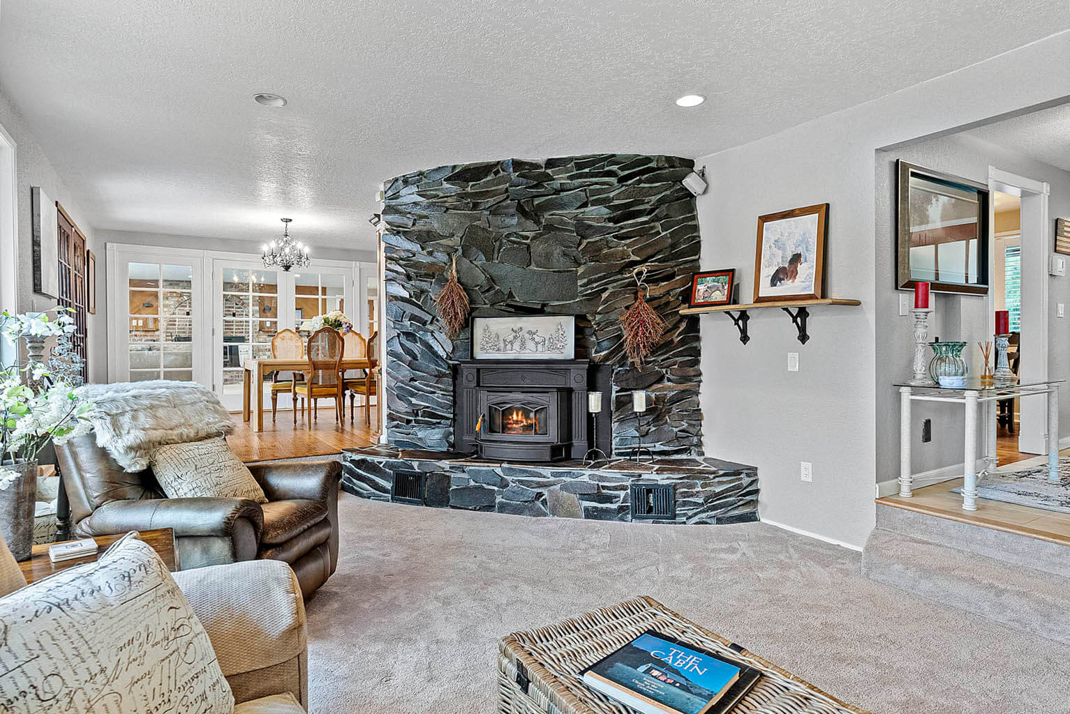 Step-down living room with rough-cut slate fireplace