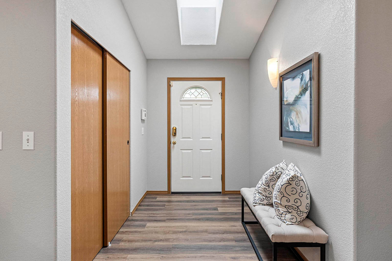Front entry with skylight and large entry hall closet