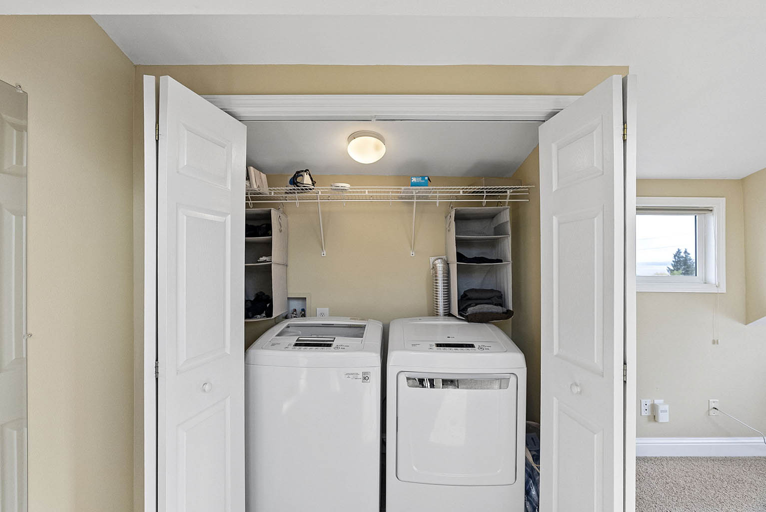 Laundry units in primary bedroom