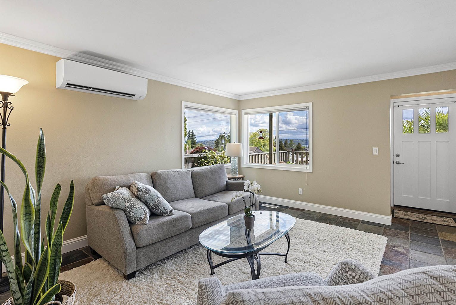 Living area with new ductless heat pump for heating and cooling