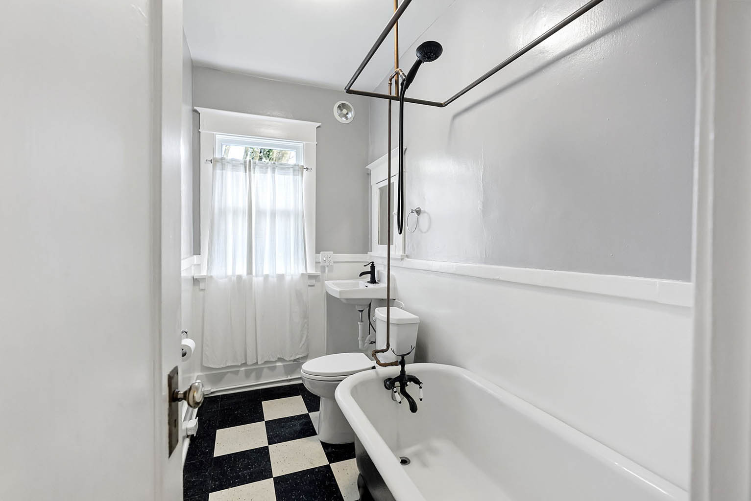 Bathroom with vintage tile and claw foot tub