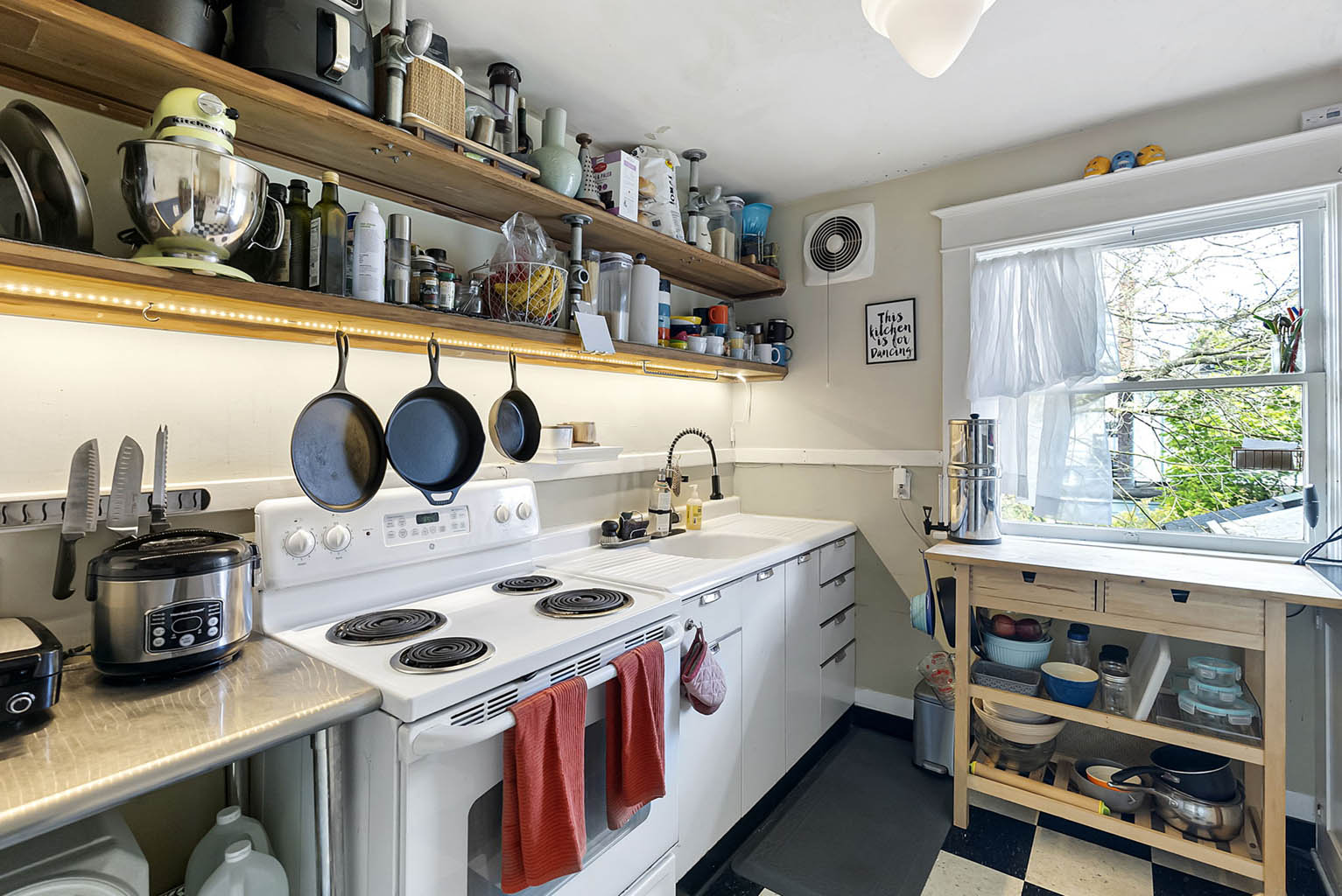 Kitchen with built-in shelving and vintage tile floor