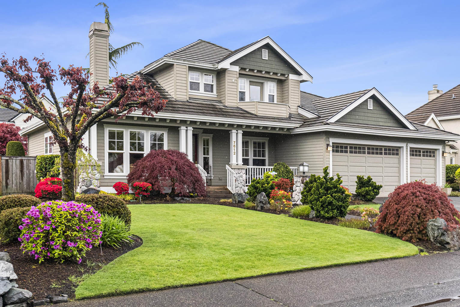 Mature landscaping and attached three car garage