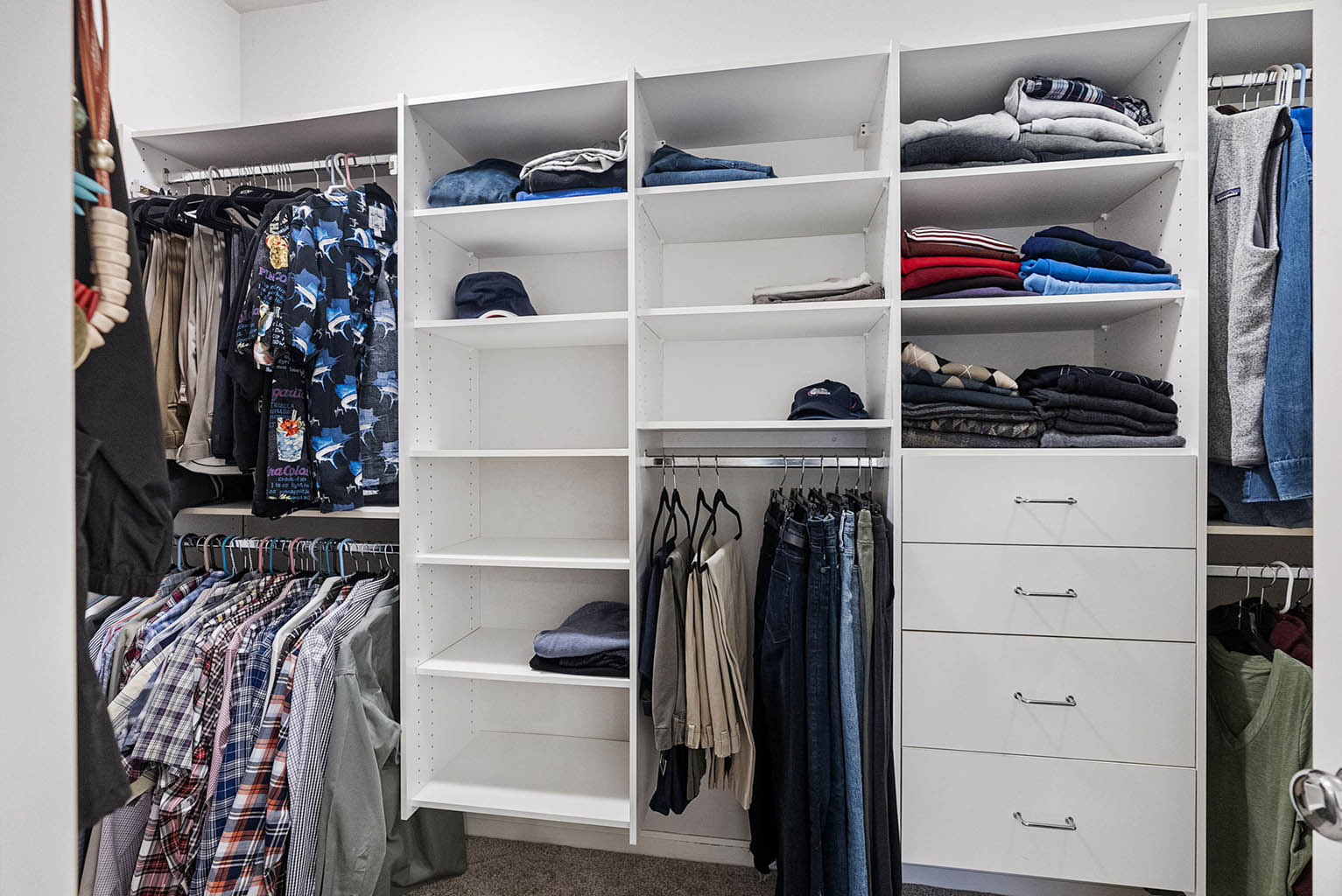 Large walk-in closet with custom built-ins