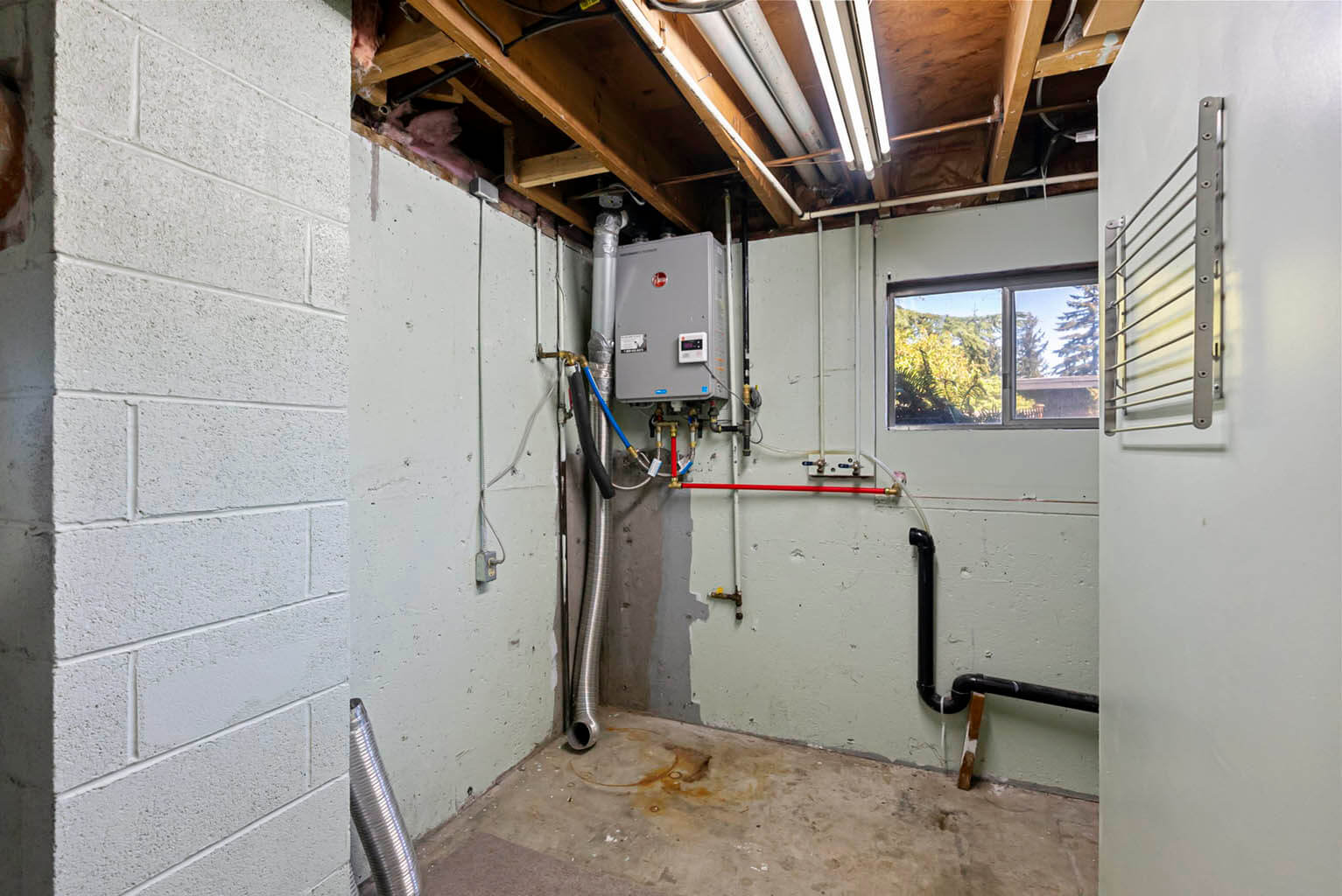 Laundry room with new tankless water heater