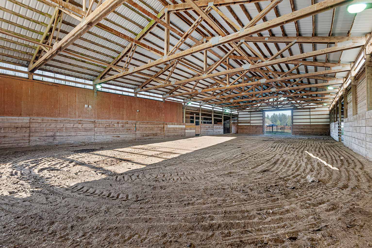 The main barn features a 72' x 120' indoor arena