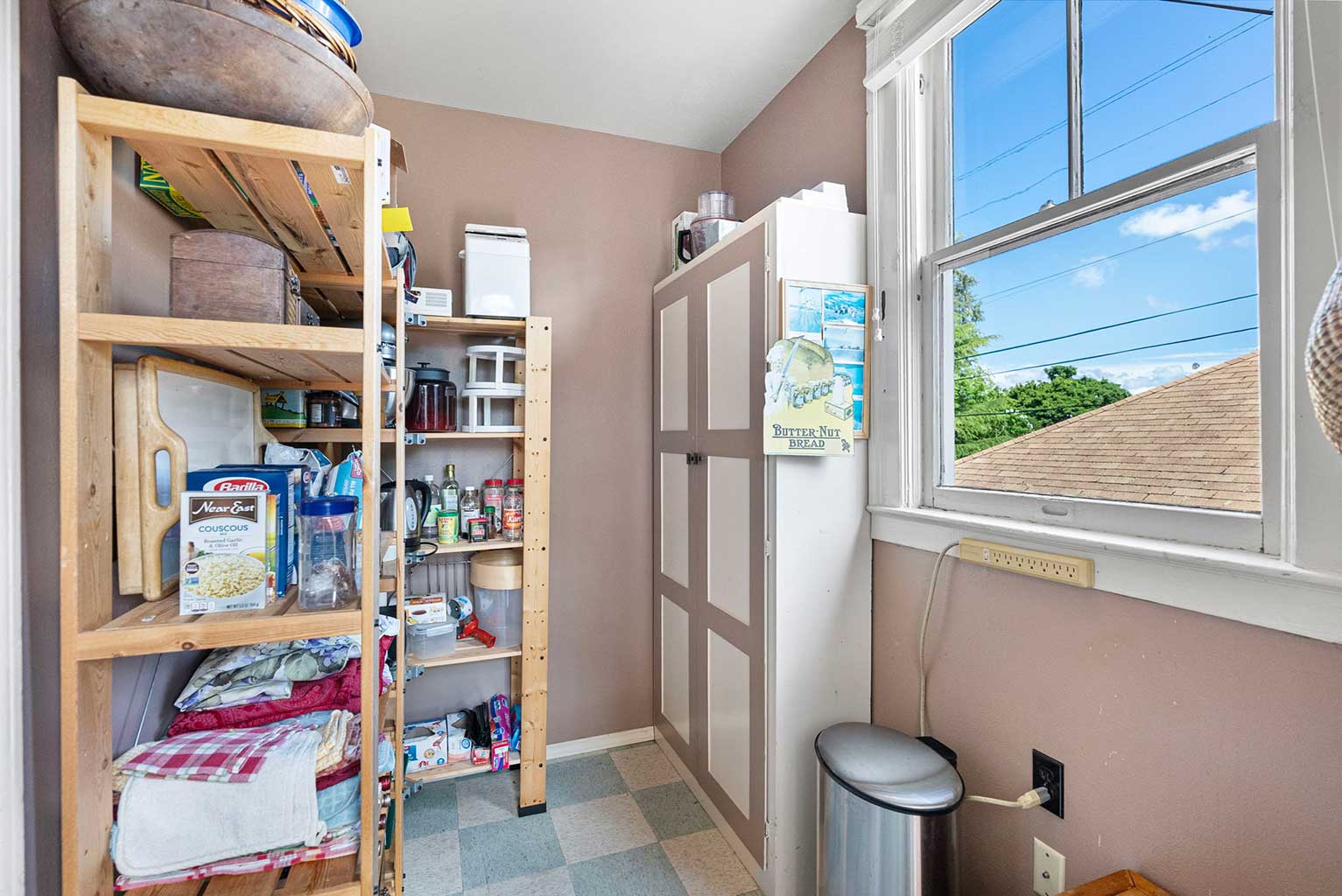 Mudroom off the kitchen is currently used as a pantry
