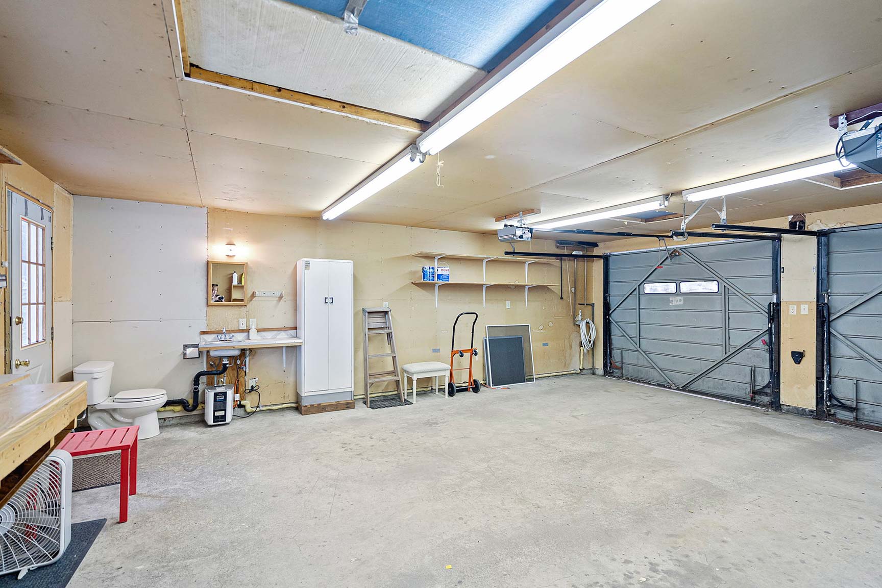 Oversized two car garage with utility toilet