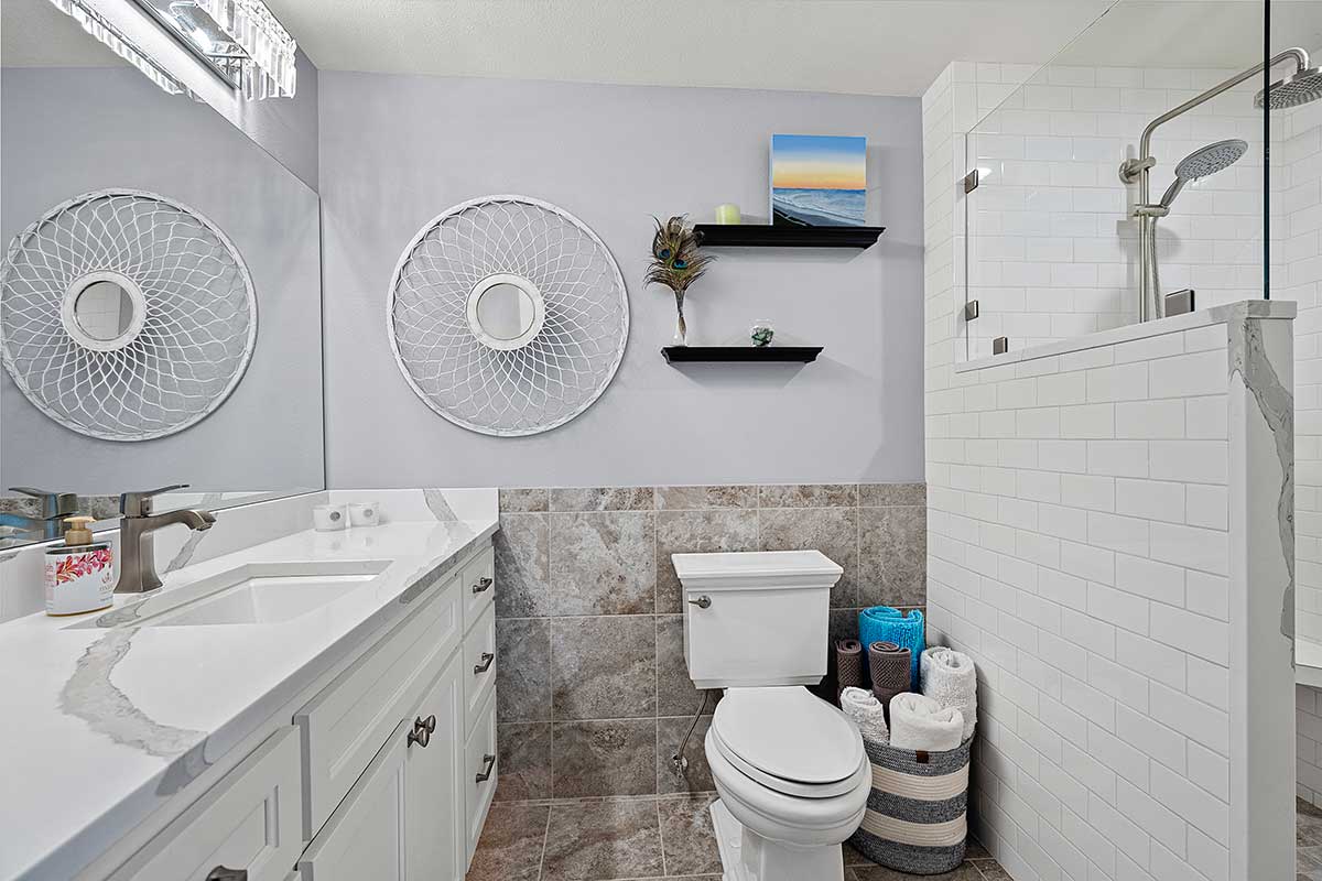 Primary bathroom with Caesarstone-topped vanity
