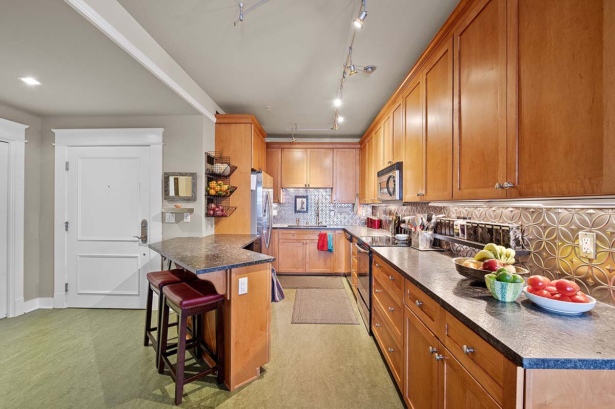 Gourmet kitchen with breakfast bar and ample cabinet storage