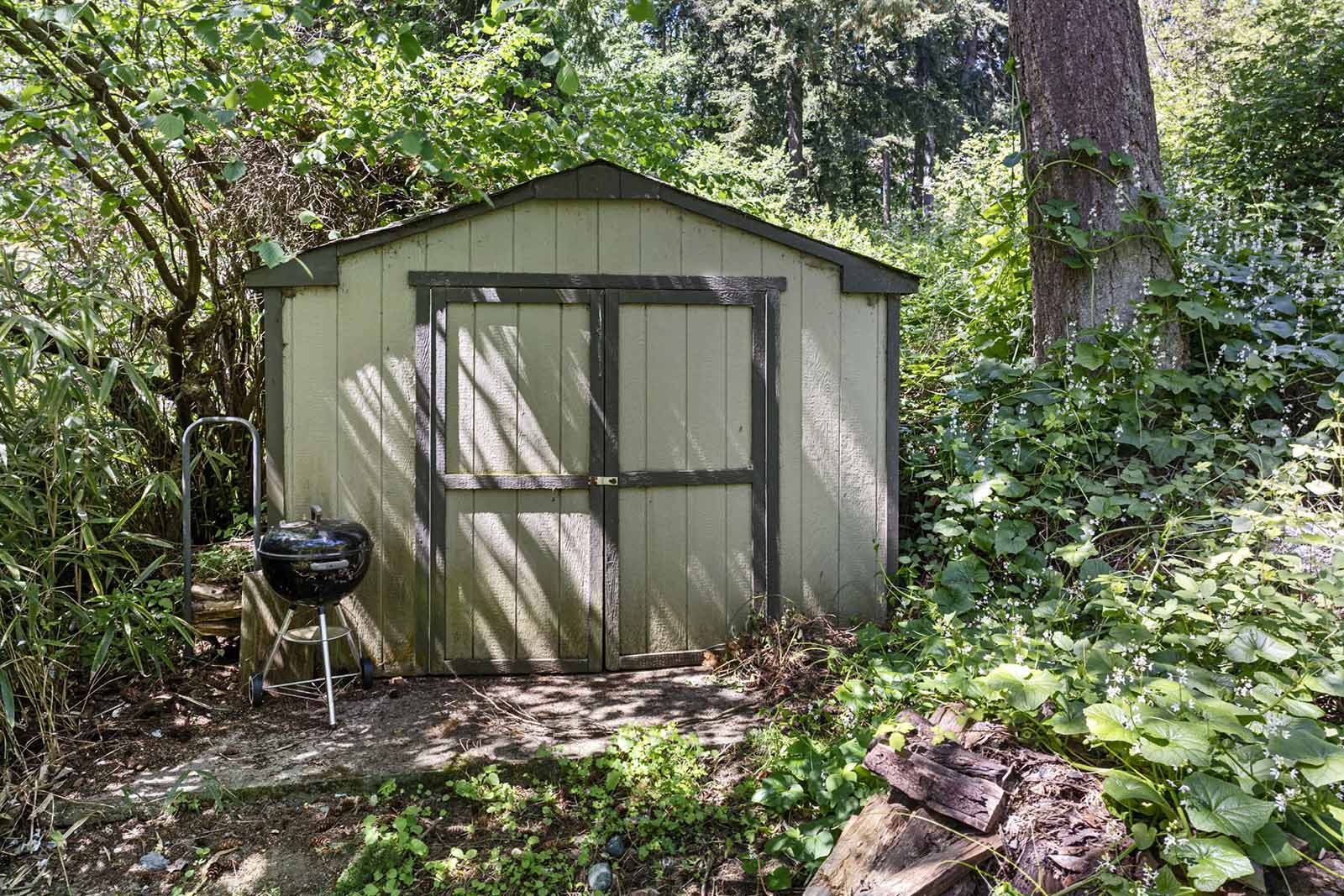 Utility shed in back yard for extra storage
