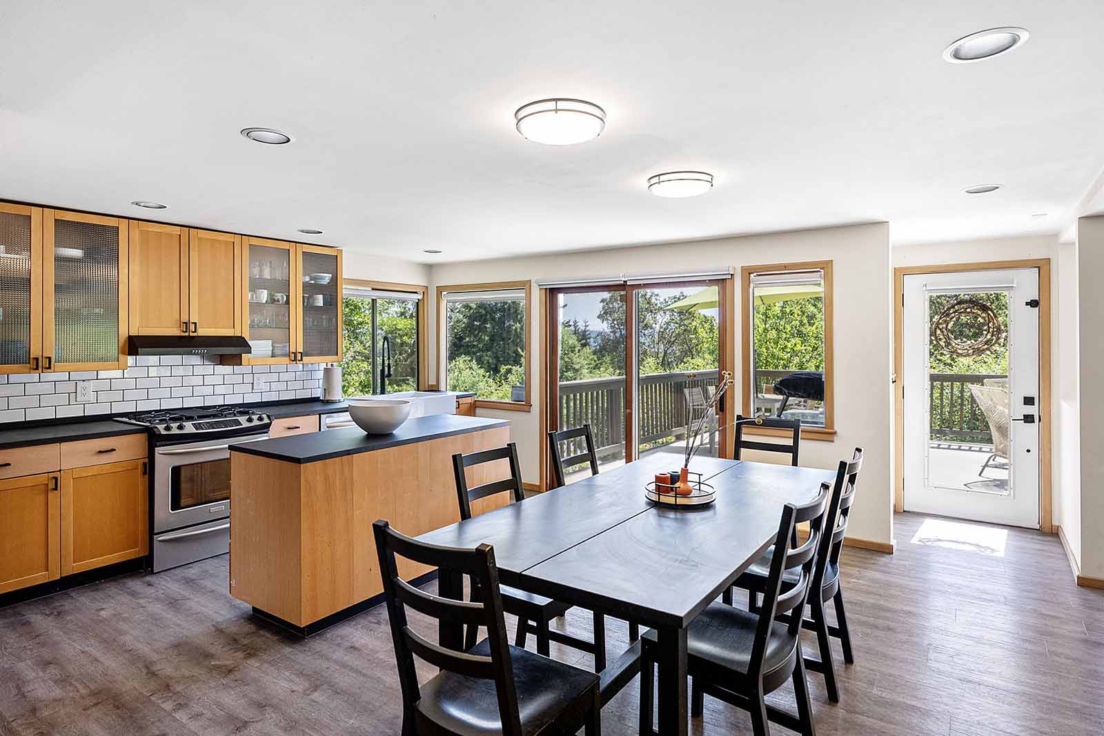 French and sliding doors offer access to a large front deck