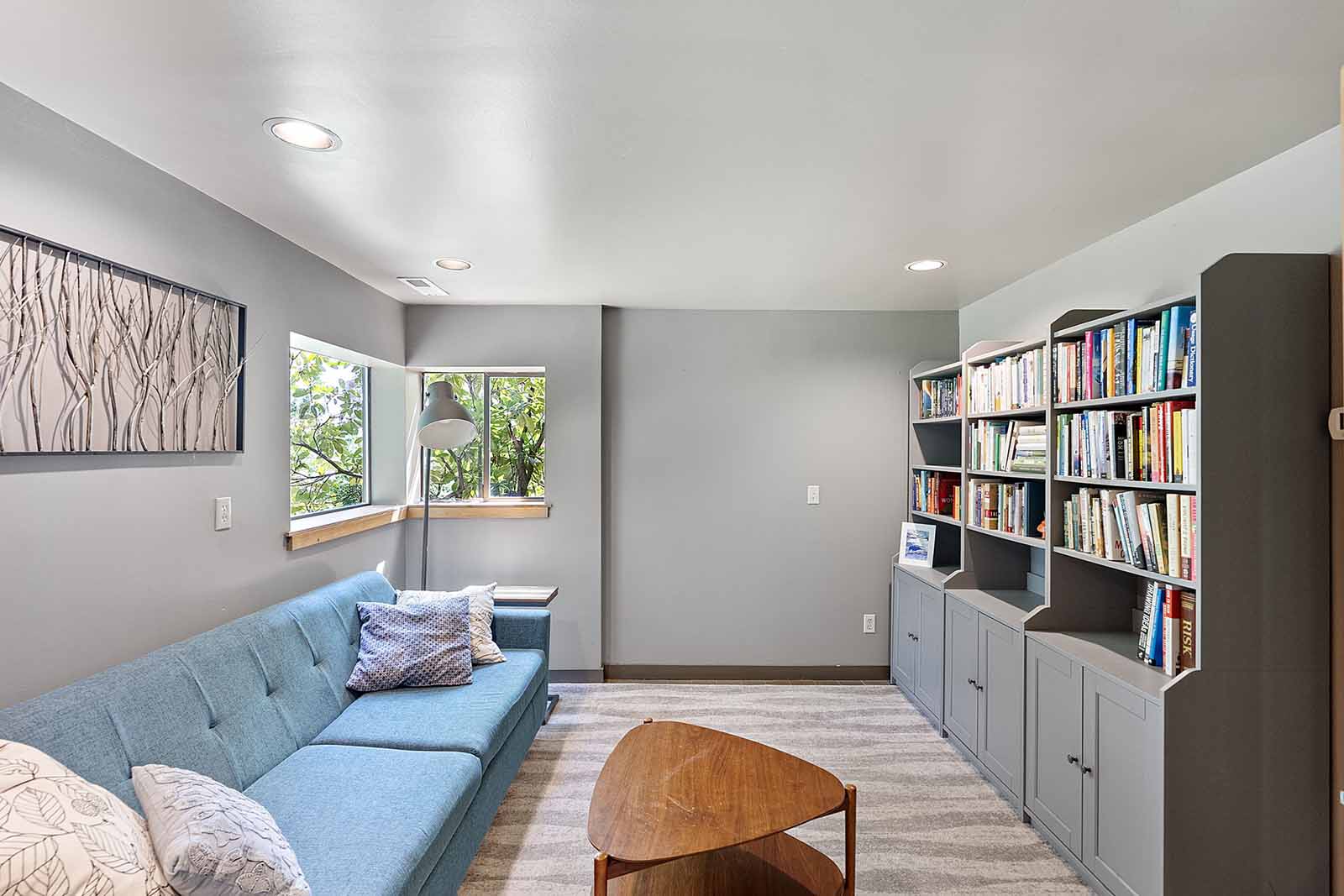 Lower level family room could easily flex as a fourth bedroom