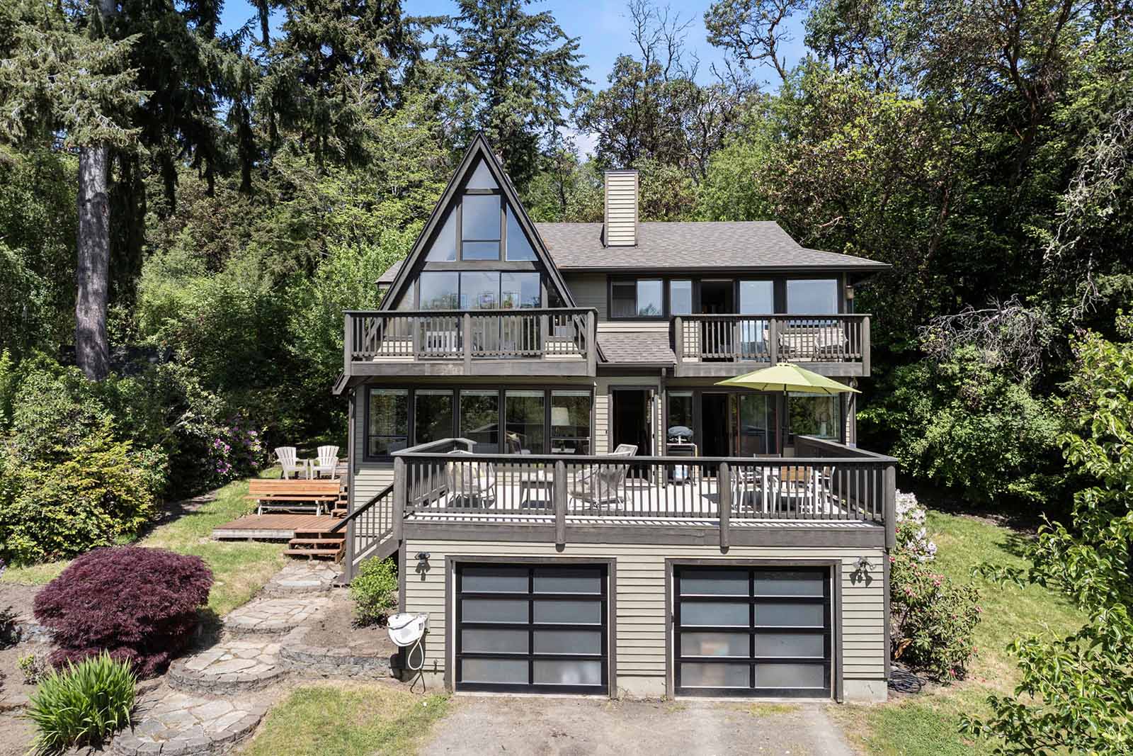 Attached two car garage with spacious deck for entertaining above