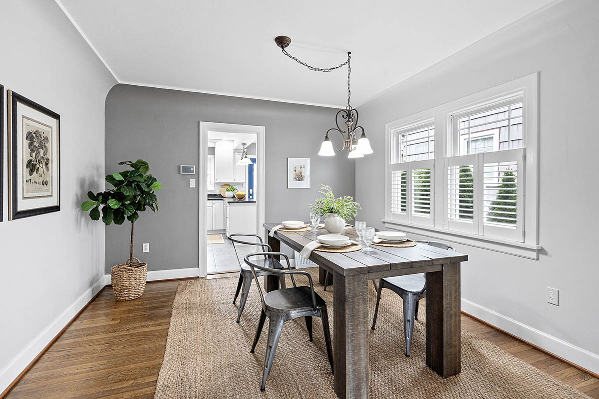 Formal dining room with coved ceiling and custom shutters