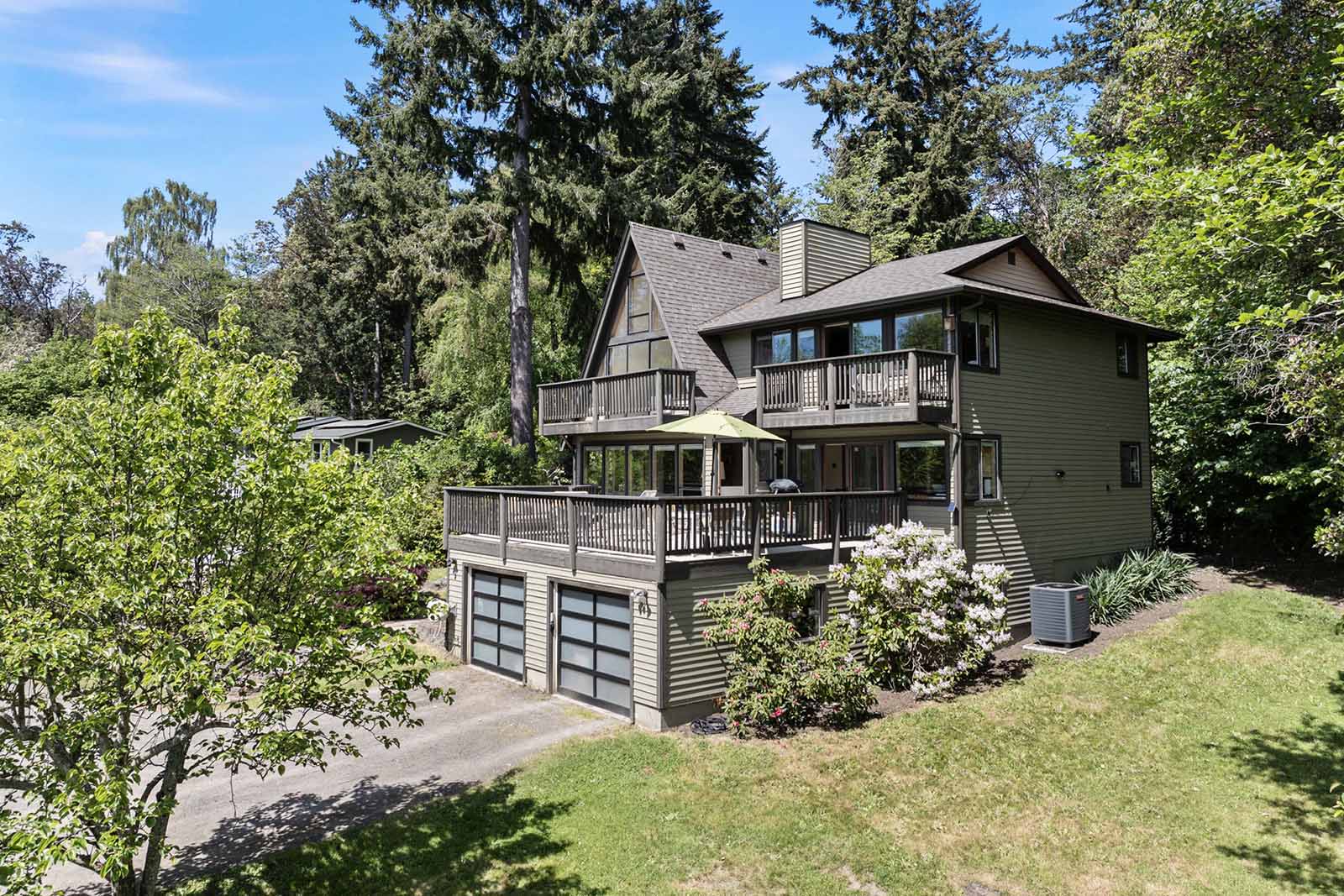 Nestled on a hill surrounded by mature foliage