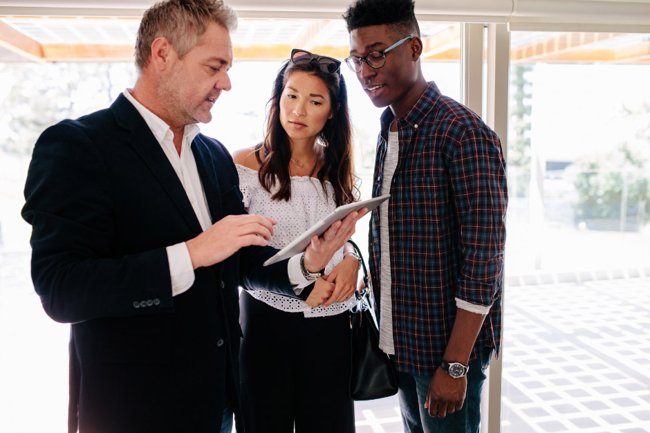 Clients meeting with real estate agent