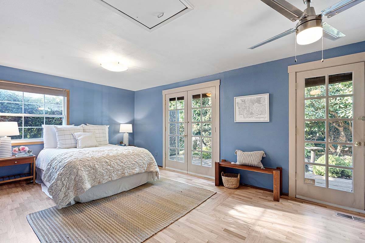 Spacious primary bedroom with newly refinished hardwood floors