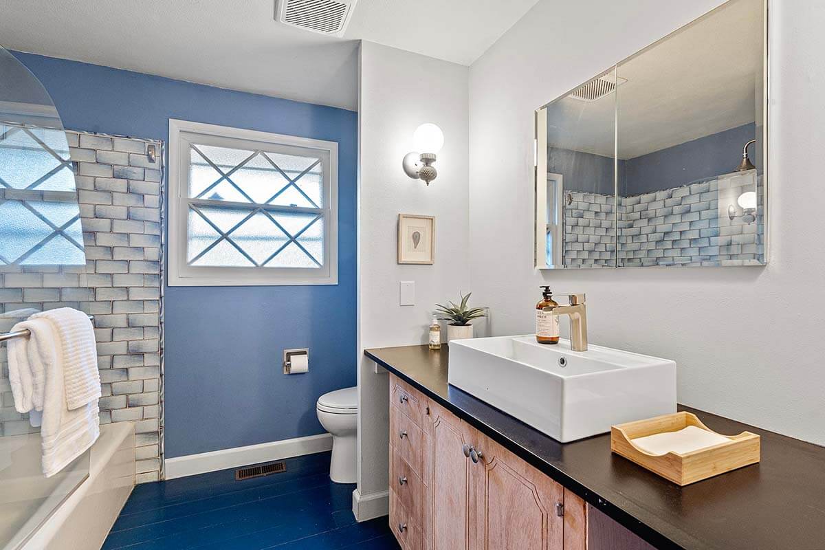 Bathroom updated in 2020 with new tile, tub, vanity top and sink