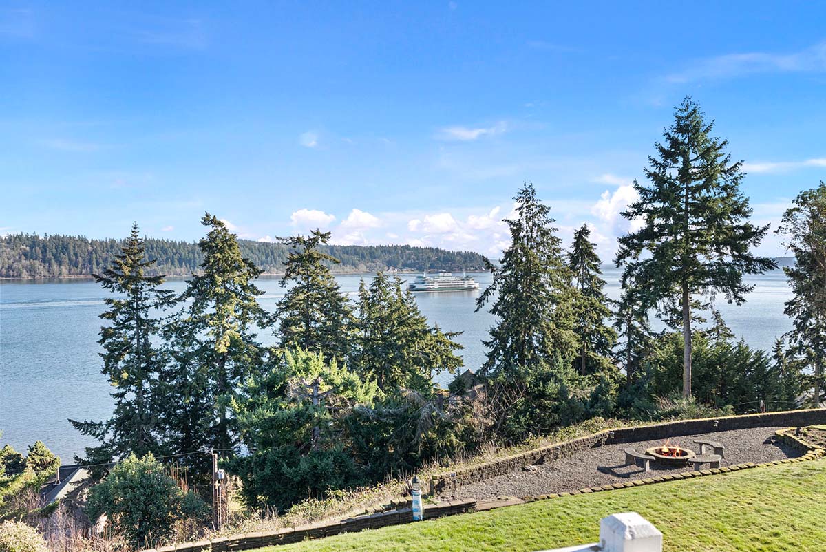 Balcony off primary bedroom offers dynamic marine traffic views