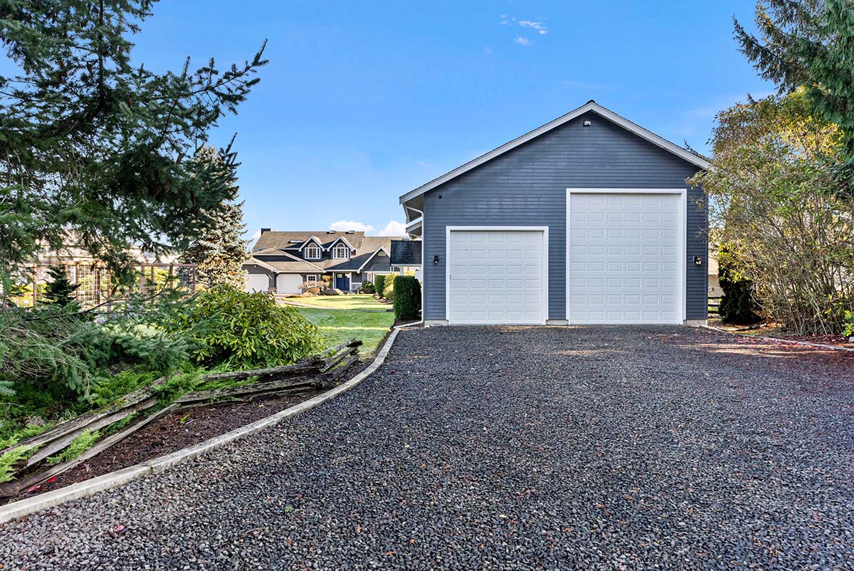 RV garage with 14' door on the right and dedicated driveway