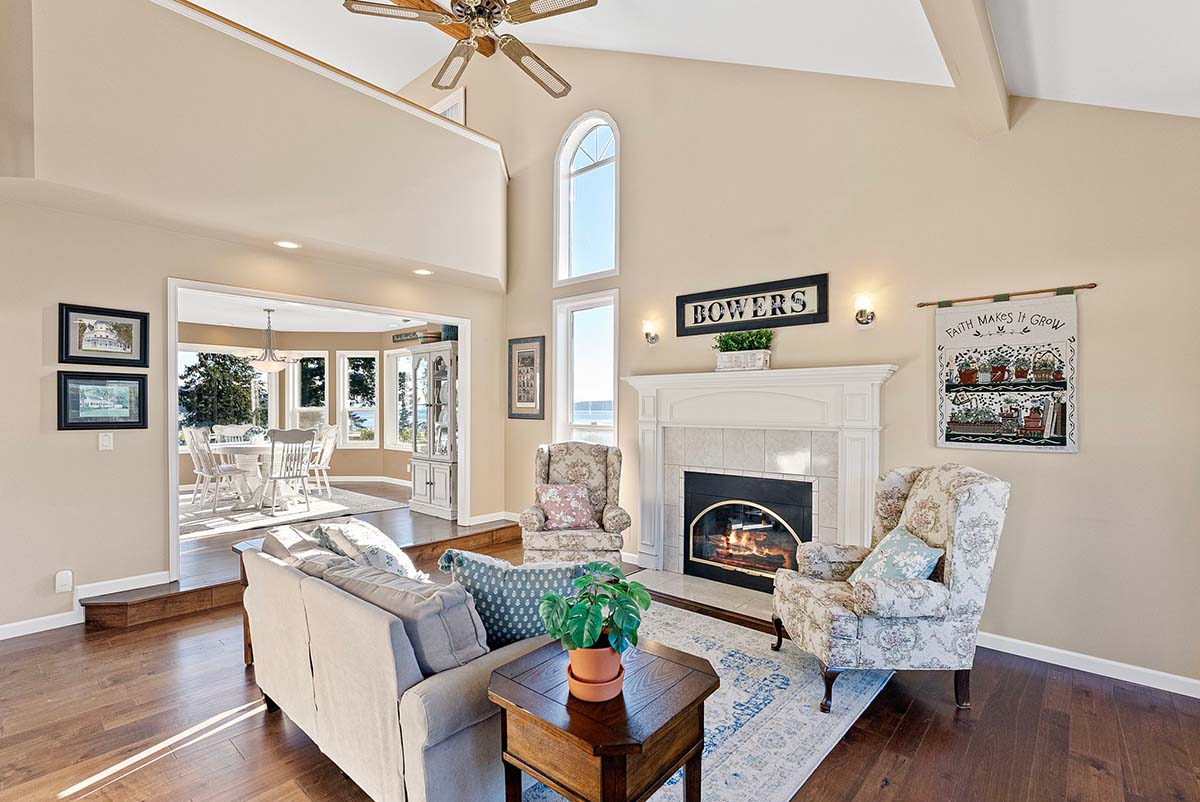 Living room with vaulted ceiling and engineered hardwood flooring