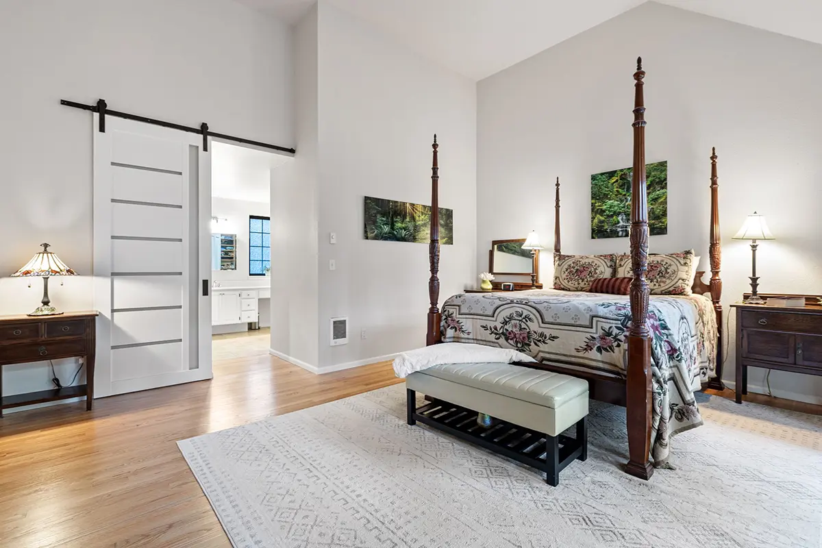 Primary bedroom with hardwood floors