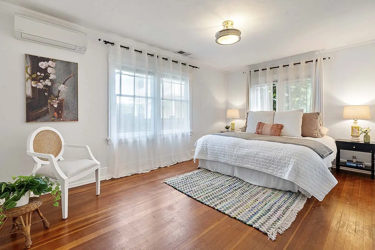 Larger of two main floor bedrooms with supplemental ductless mini-split