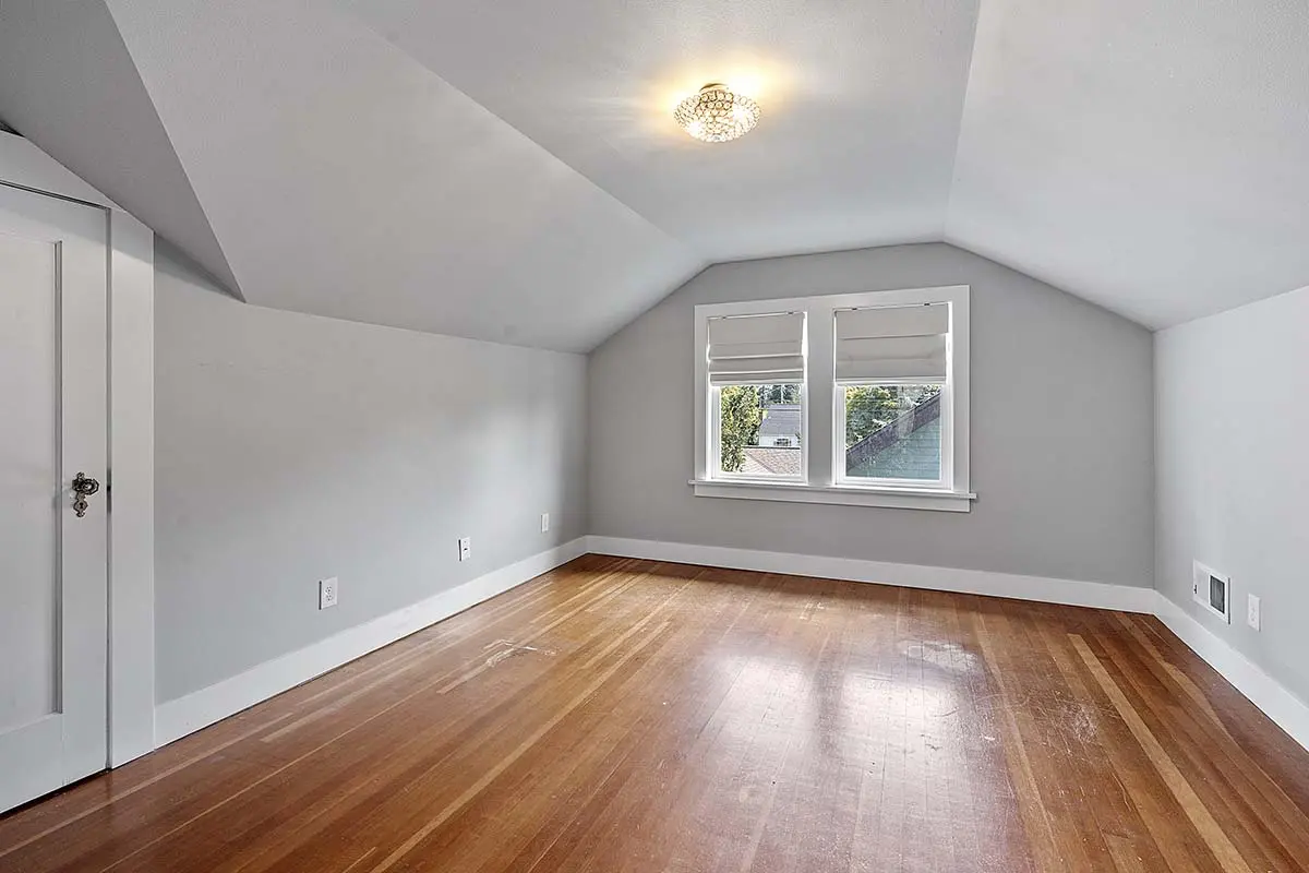 One of two upstairs bedrooms with fir flooring